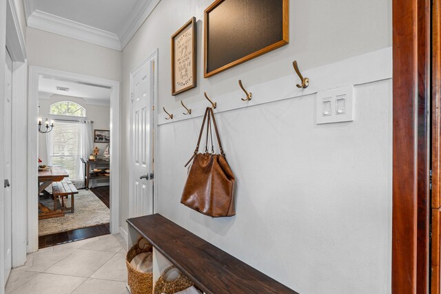 2413 Sawgrass Ct, League City, TX 77573 - mudroom featuring crown molding and light tile patterned flooring