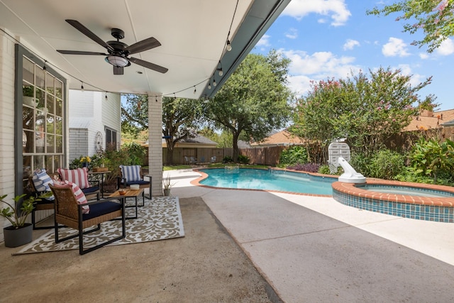 2413 Sawgrass Ct, League City, TX 77573 - view of swimming pool featuring a ceiling fan, a pool with connected hot tub, a fenced backyard, and a patio area