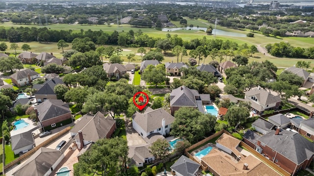 2413 Sawgrass Ct, League City, TX 77573 - aerial view of residential area featuring a large body of water and a golf club