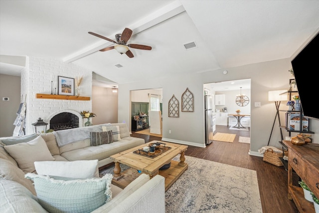 12502 Nova Dr, Houston, TX 77077 - living area featuring a ceiling fan, a fireplace, and dark wood-style flooring
