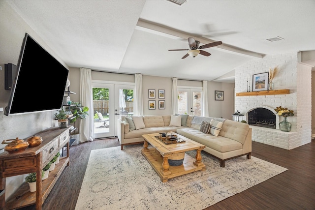 12502 Nova Dr, Houston, TX 77077 - living room featuring french doors, ceiling fan, wood finished floors, and a fireplace