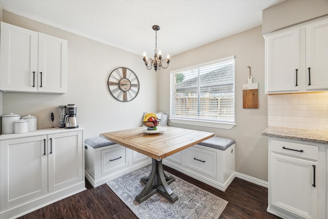 12502 Nova Dr, Houston, TX 77077 - dining room with dark wood-style flooring, a chandelier, and breakfast area