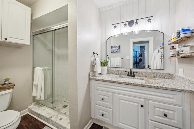 12502 Nova Dr, Houston, TX 77077 - bathroom with a shower stall, vanity, and wood finished floors