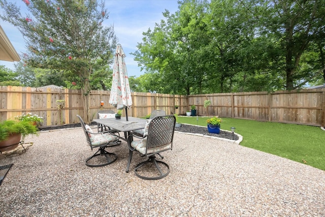 12502 Nova Dr, Houston, TX 77077 - fenced backyard with outdoor dining area and a patio area