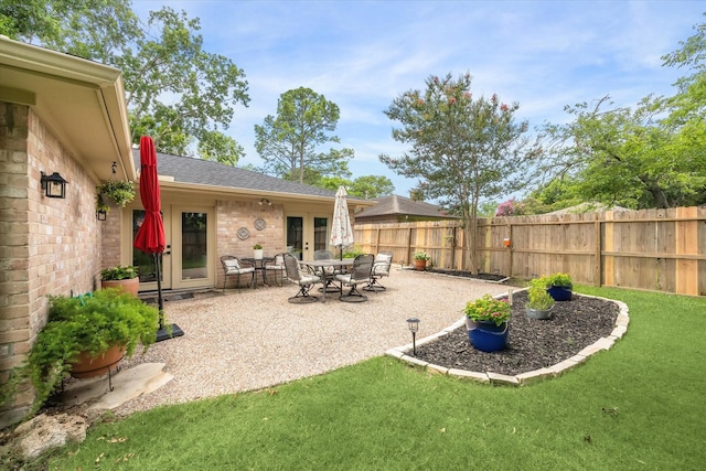 12502 Nova Dr, Houston, TX 77077 - fenced backyard with french doors and a patio area