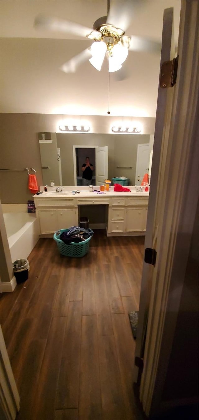 109 Smokey Lake Ln, Dickinson, TX 77539 - bathroom with hardwood / wood-style floors, a bath, vanity, and ceiling fan