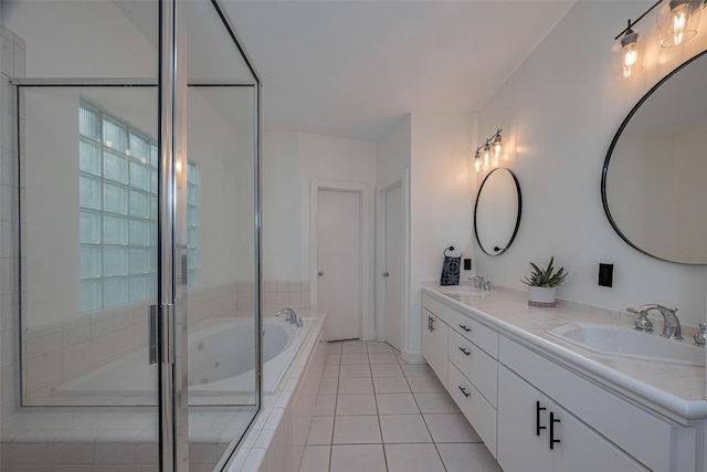 308 Dennis St, Houston, TX 77006 - bathroom featuring double vanity, a whirlpool tub, tile patterned flooring, and a tile shower