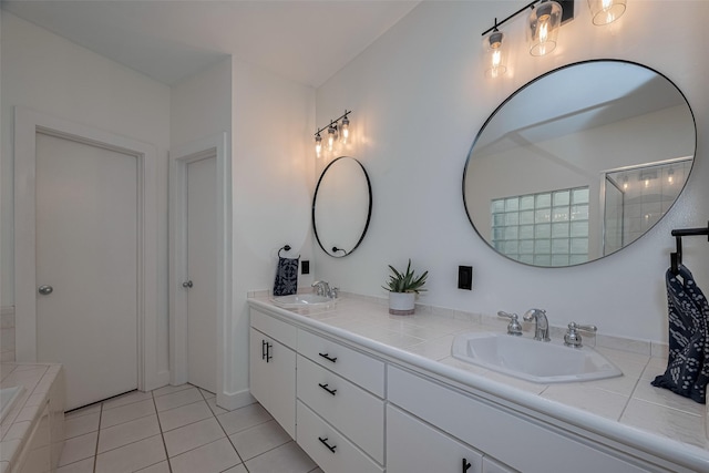 308 Dennis St, Houston, TX 77006 - bathroom featuring double vanity and tile patterned floors