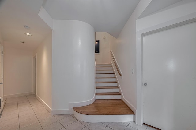 308 Dennis St, Houston, TX 77006 - stairway featuring tile patterned flooring and vaulted ceiling
