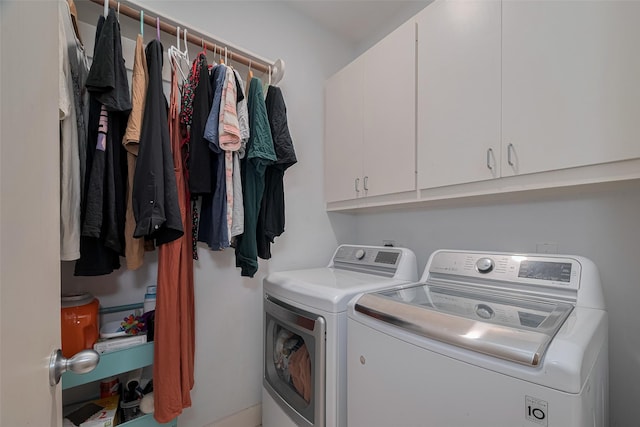 308 Dennis St, Houston, TX 77006 - laundry area with washer and clothes dryer and cabinet space