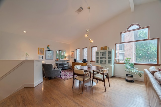 308 Dennis St, Houston, TX 77006 - dining space with high vaulted ceiling and light wood-style flooring