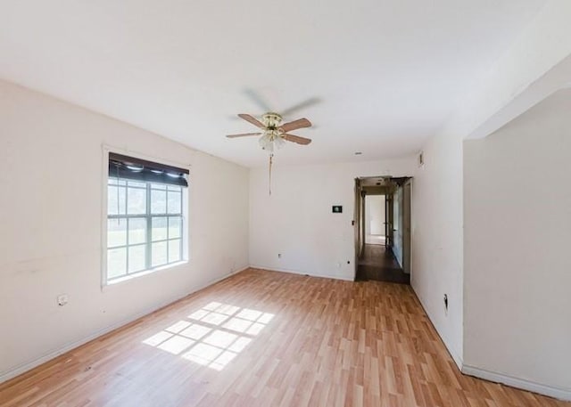 222 E Southland Ave, Alvin, TX 77511 - empty room with light wood finished floors and a ceiling fan