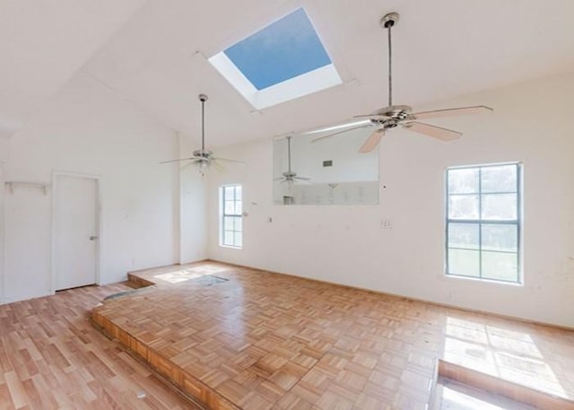 222 E Southland Ave, Alvin, TX 77511 - empty room featuring a ceiling fan, a skylight, high vaulted ceiling, and parquet flooring