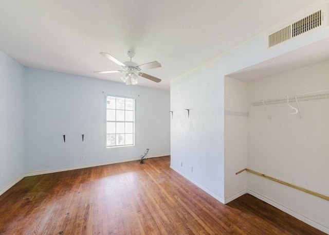 222 E Southland Ave, Alvin, TX 77511 - unfurnished bedroom featuring wood finished floors and ceiling fan