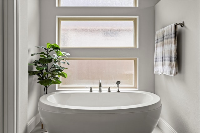 13819 Windward Harbor Ct, Houston, TX 77059 - bathroom with healthy amount of natural light and a tub