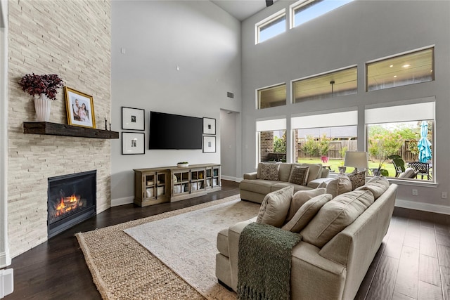13819 Windward Harbor Ct, Houston, TX 77059 - living area with a high ceiling, dark wood-style flooring, and a fireplace