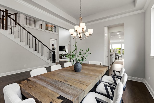 13819 Windward Harbor Ct, Houston, TX 77059 - dining room featuring stairs, a chandelier, a tray ceiling, and dark wood-type flooring