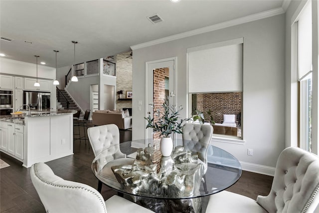 13819 Windward Harbor Ct, Houston, TX 77059 - dining area featuring stairway, dark wood-style flooring, crown molding, and recessed lighting