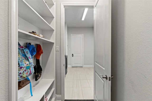 13819 Windward Harbor Ct, Houston, TX 77059 - mudroom with light tile patterned floors and baseboards