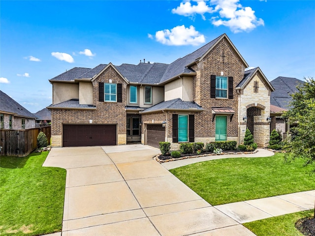 13819 Windward Harbor Ct, Houston, TX 77059 - view of front facade with concrete driveway, stucco siding, an attached garage, and brick siding
