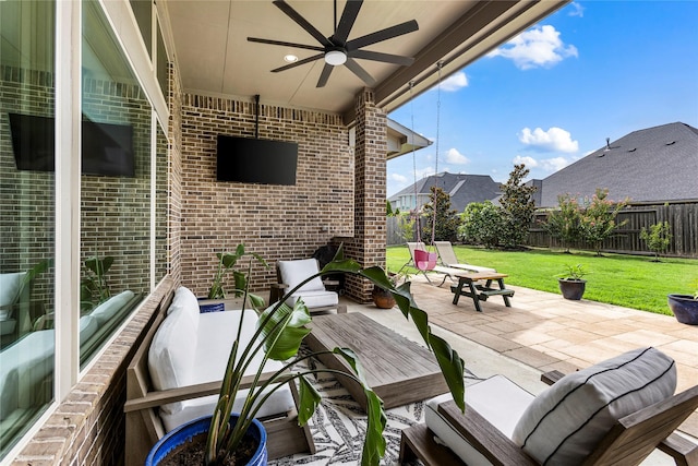 13819 Windward Harbor Ct, Houston, TX 77059 - fenced backyard with a ceiling fan, a patio, and an outdoor hangout area