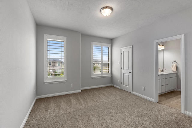 13819 Windward Harbor Ct, Houston, TX 77059 - unfurnished bedroom with carpet, ensuite bath, and a textured ceiling