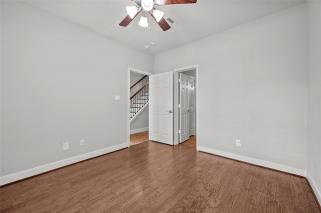 2338 Bastrop St, Houston, TX 77004 - unfurnished bedroom featuring wood finished floors, a spacious closet, and ceiling fan