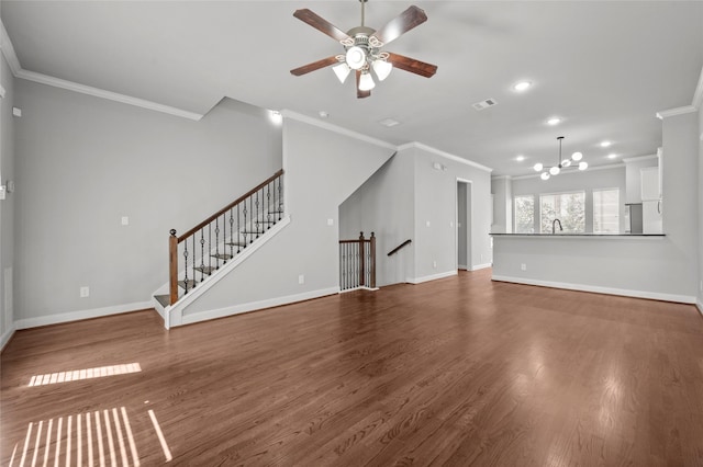 2338 Bastrop St, Houston, TX 77004 - unfurnished living room with ornamental molding, a chandelier, ceiling fan, dark wood finished floors, and recessed lighting