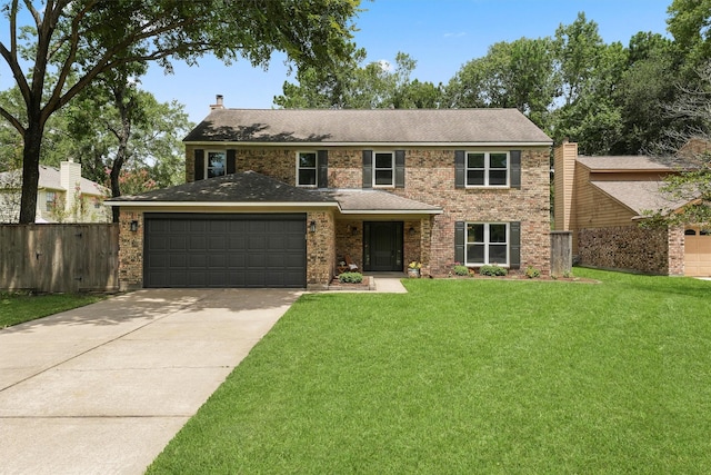 3715 Ember Spring Dr, Kingwood, TX 77339 - view of front facade with concrete driveway, an attached garage, brick siding, and a chimney