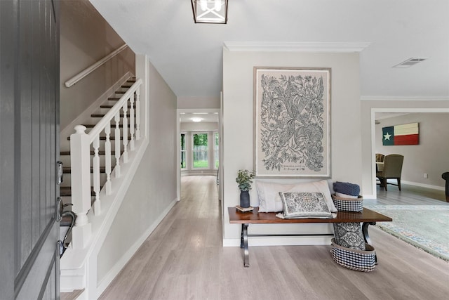 3715 Ember Spring Dr, Kingwood, TX 77339 - entryway featuring wood finished floors, stairway, and ornamental molding