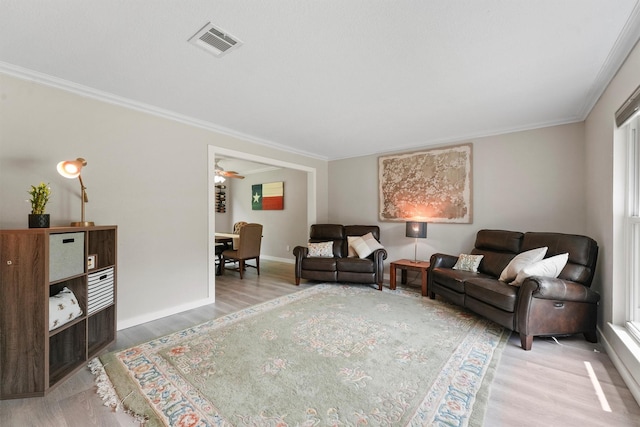 3715 Ember Spring Dr, Kingwood, TX 77339 - living area featuring wood finished floors and ornamental molding