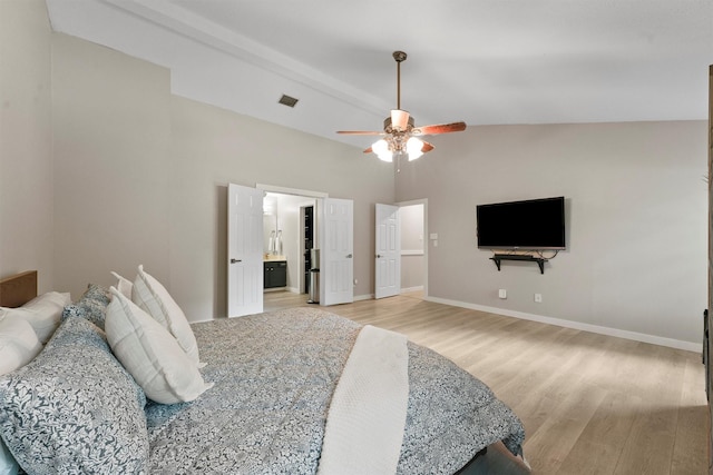 3715 Ember Spring Dr, Kingwood, TX 77339 - bedroom featuring light wood finished floors, ceiling fan, connected bathroom, and a high ceiling