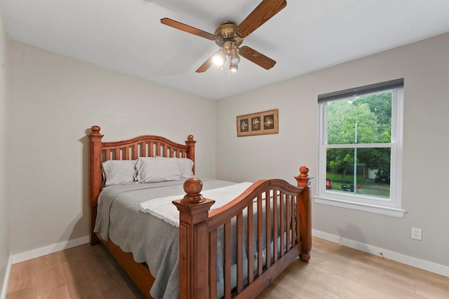 3715 Ember Spring Dr, Kingwood, TX 77339 - bedroom featuring wood finished floors and a ceiling fan