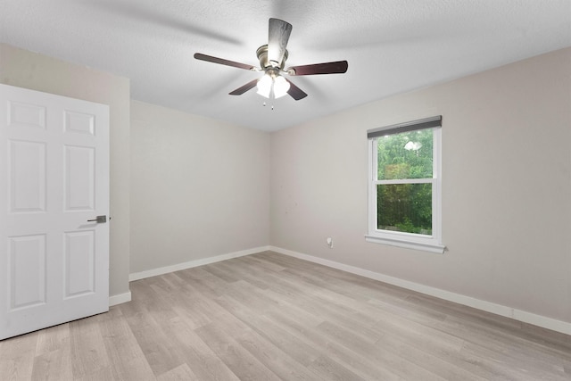 3715 Ember Spring Dr, Kingwood, TX 77339 - unfurnished room featuring light wood-type flooring, ceiling fan, and a textured ceiling