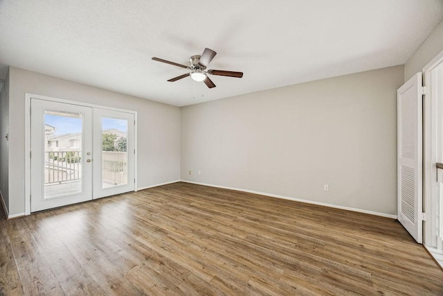 7350 Kirby Dr Unit 46, Houston, TX 77030 - spare room with french doors, ceiling fan, and wood finished floors