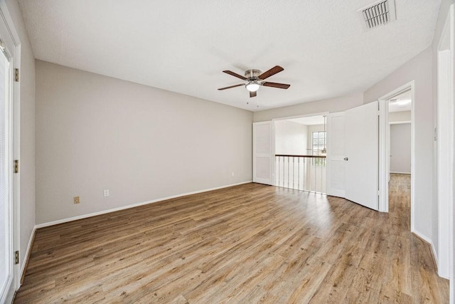 7350 Kirby Dr Unit 46, Houston, TX 77030 - spare room with ceiling fan and light wood-style flooring