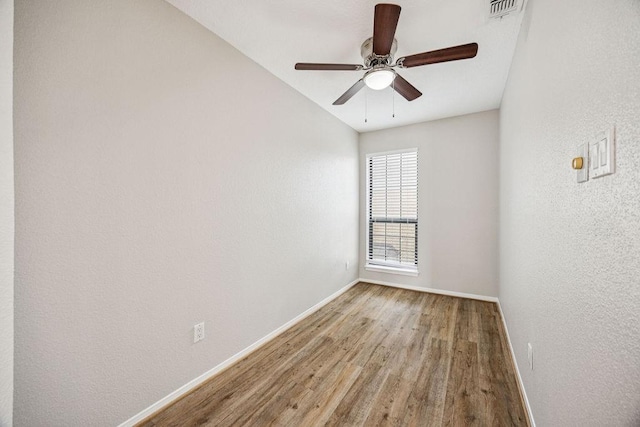 7350 Kirby Dr Unit 46, Houston, TX 77030 - empty room with wood finished floors and ceiling fan