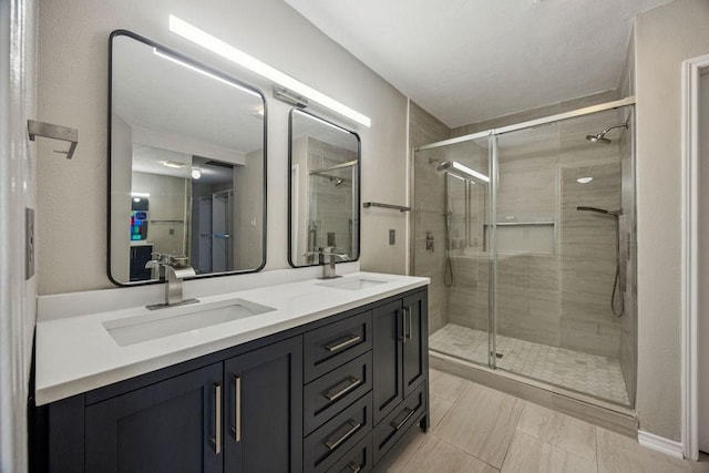 7350 Kirby Dr Unit 46, Houston, TX 77030 - bathroom with double vanity and a shower stall