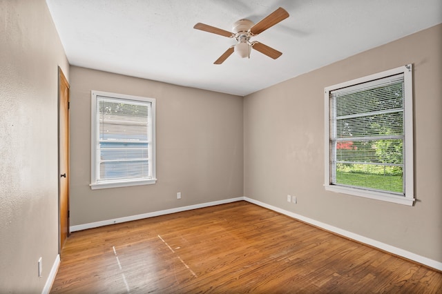 5532 Meadow Creek Ln, Houston, TX 77017 - unfurnished room with wood finished floors, plenty of natural light, and ceiling fan