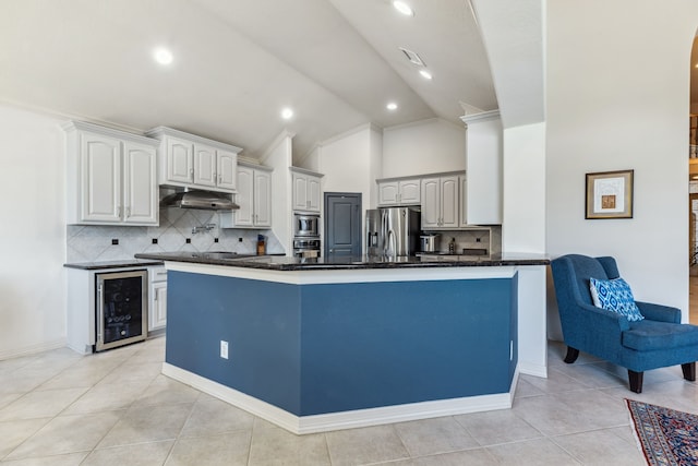 8411 Middle Canyon Rd, Katy, TX 77494 - kitchen featuring beverage cooler, stainless steel appliances, tasteful backsplash, light tile patterned floors, and recessed lighting