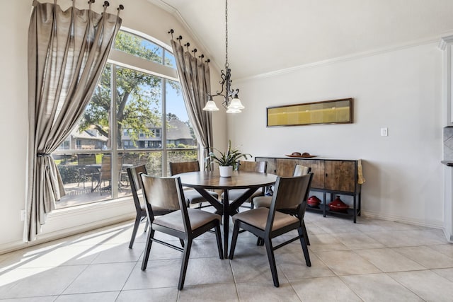 8411 Middle Canyon Rd, Katy, TX 77494 - dining room featuring ornamental molding, lofted ceiling, light tile patterned floors, and a chandelier
