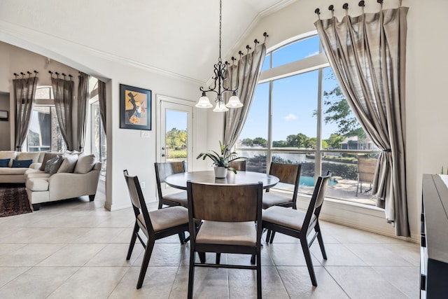 8411 Middle Canyon Rd, Katy, TX 77494 - dining room with crown molding, light tile patterned floors, a water view, and high vaulted ceiling