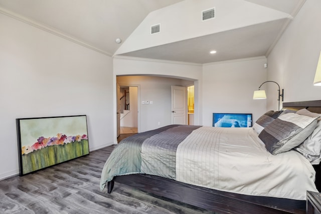8411 Middle Canyon Rd, Katy, TX 77494 - bedroom featuring arched walkways, vaulted ceiling, wood finished floors, crown molding, and recessed lighting