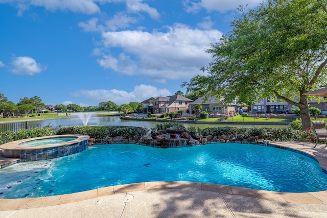 8411 Middle Canyon Rd, Katy, TX 77494 - view of swimming pool featuring a pool with connected hot tub and a water view