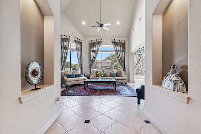 8411 Middle Canyon Rd, Katy, TX 77494 - tiled foyer entrance featuring high vaulted ceiling, ceiling fan, crown molding, and arched walkways