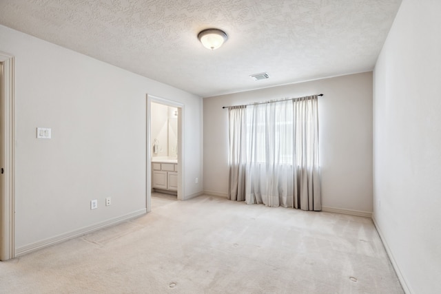 8411 Middle Canyon Rd, Katy, TX 77494 - unfurnished room featuring light colored carpet and a textured ceiling