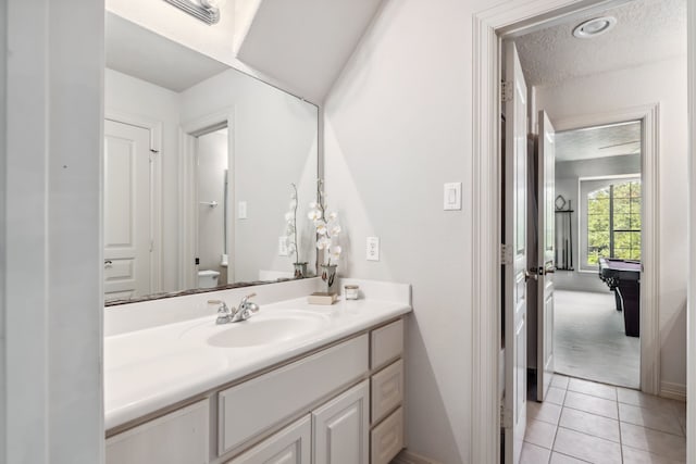 8411 Middle Canyon Rd, Katy, TX 77494 - bathroom featuring vanity, tile patterned floors, and a textured ceiling