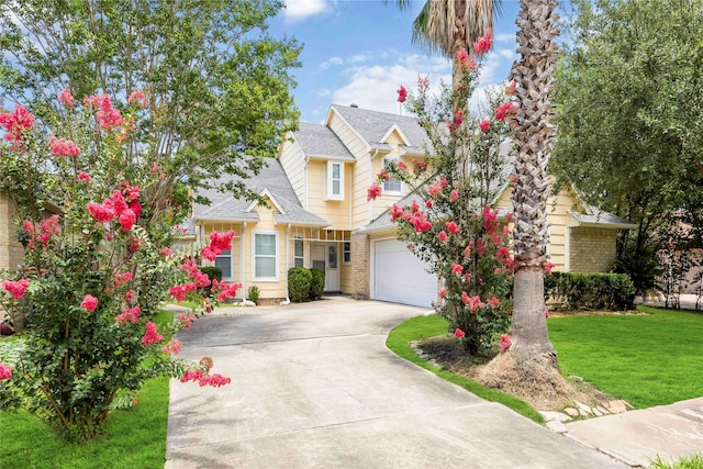 11510 Pagoda Dr, Houston, TX 77477 - traditional-style house with concrete driveway, a garage, a front lawn, and roof with shingles
