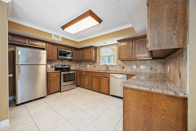11510 Pagoda Dr, Houston, TX 77477 - kitchen featuring stainless steel appliances, ornamental molding, tasteful backsplash, light stone countertops, and light tile patterned floors
