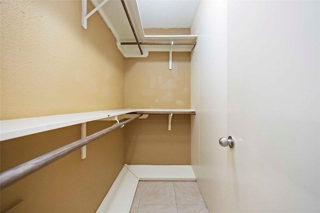 11510 Pagoda Dr, Houston, TX 77477 - walk in closet with tile patterned flooring